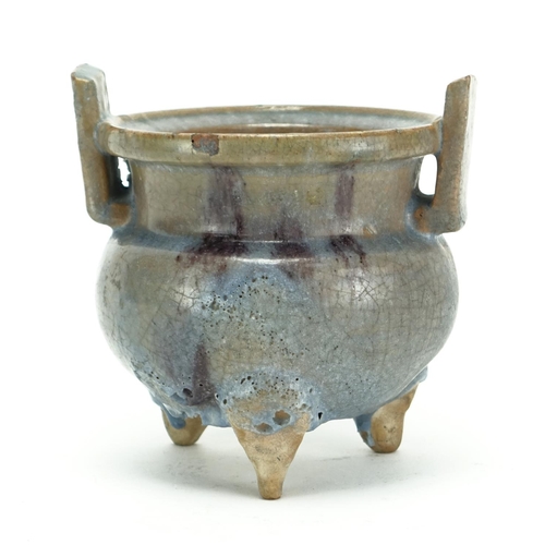 344 - Chinese pottery tripod censer with twin handles, having a turquoise and purple glaze, 12.5cm high