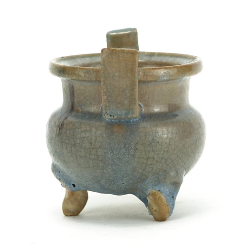 344 - Chinese pottery tripod censer with twin handles, having a turquoise and purple glaze, 12.5cm high