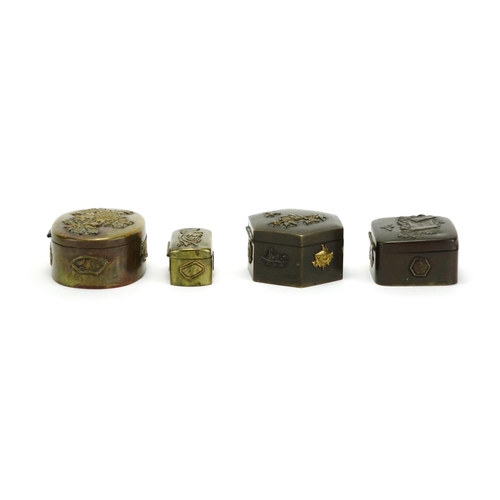 383 - Japanese bronze and brass metalware including four trinket boxes, decorated with birds of paradise a... 