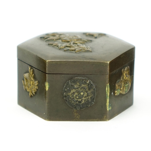 383 - Japanese bronze and brass metalware including four trinket boxes, decorated with birds of paradise a... 