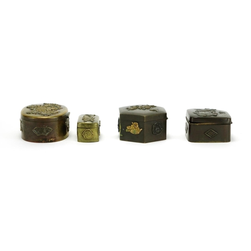 383 - Japanese bronze and brass metalware including four trinket boxes, decorated with birds of paradise a... 