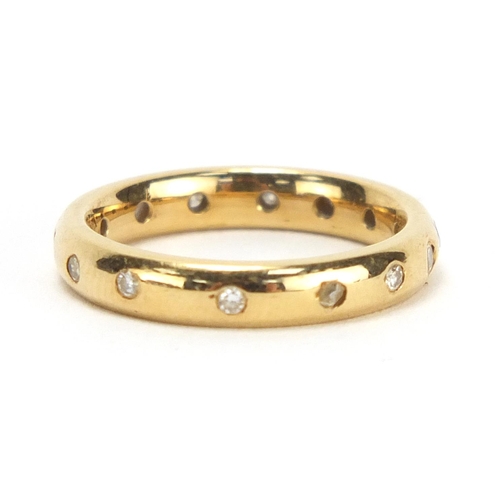 749 - 18ct gold diamond eternity ring, retailed by Garrard, housed in a tooled leather box, size J, approx... 