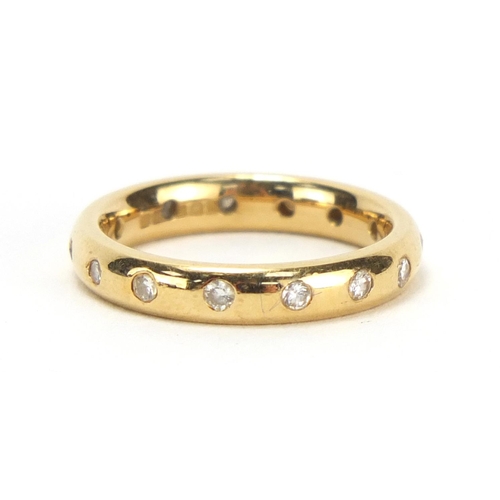 749 - 18ct gold diamond eternity ring, retailed by Garrard, housed in a tooled leather box, size J, approx... 