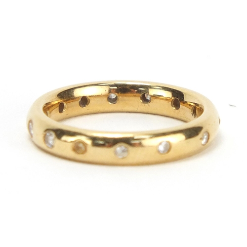 749 - 18ct gold diamond eternity ring, retailed by Garrard, housed in a tooled leather box, size J, approx... 