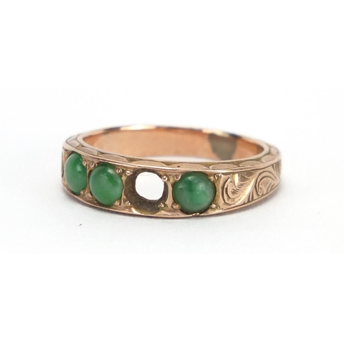 790 - Unmarked gold cabochon jade ring, the band with engraved decoration, size M,  approximate weight 3.7... 