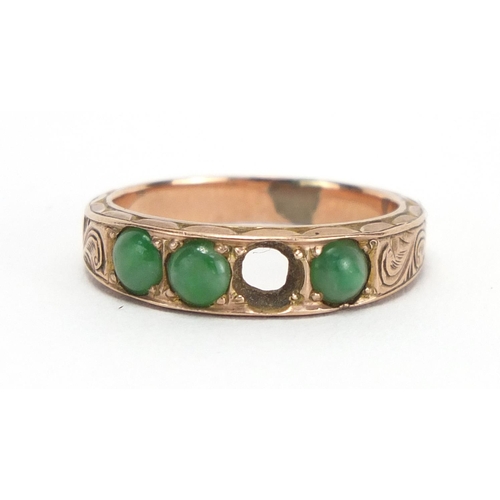 790 - Unmarked gold cabochon jade ring, the band with engraved decoration, size M,  approximate weight 3.7... 