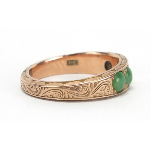 790 - Unmarked gold cabochon jade ring, the band with engraved decoration, size M,  approximate weight 3.7... 