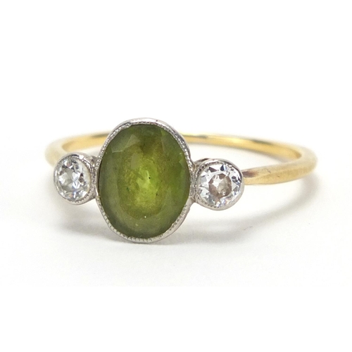 725 - Unmarked gold peridot and diamond ring, size R, approximate weight 2.4g