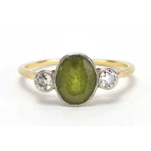 725 - Unmarked gold peridot and diamond ring, size R, approximate weight 2.4g