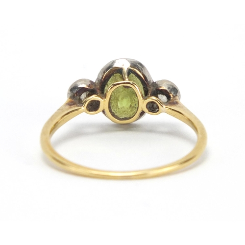 725 - Unmarked gold peridot and diamond ring, size R, approximate weight 2.4g