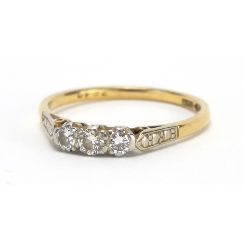 774 - 18ct gold and platinum diamond three stone ring, size T, approximate weight 3.3g