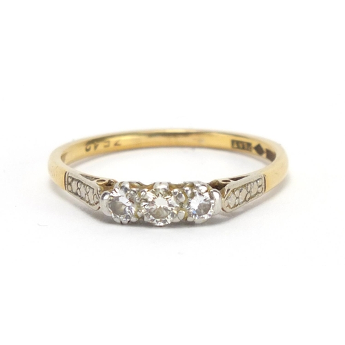 774 - 18ct gold and platinum diamond three stone ring, size T, approximate weight 3.3g