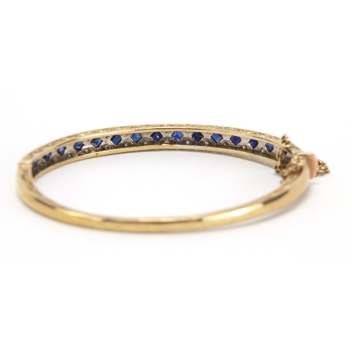 747 - 9ct gold sapphire and diamond bangle, G & T J makers mark, 6.5cm wide, approximate weight 16.1g