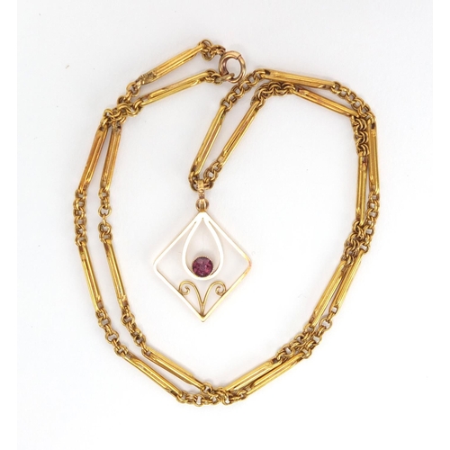 748 - Art Nouveau 9ct gold pink stone pendant, on a 9ct gold necklace, the pendant 2.8cm in length, approx... 