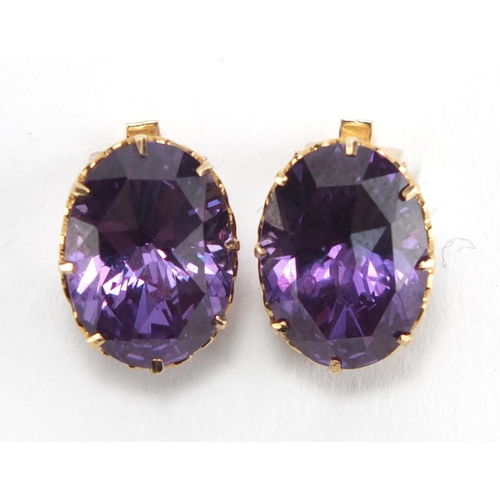 717 - 18ct gold synthetic Alexandrite ring and matching earrings, the ring size Q, approximate weight 8.3g