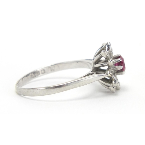 727 - 18ct white gold ruby and diamond flower head ring, size O, approximate weight 3.2g