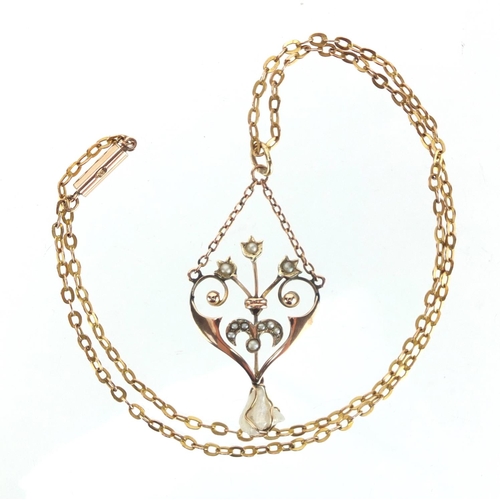 719 - Art Nouveau 9ct gold seed pearl pendant on a 9ct gold necklace, the pendant 4.7cm in length, approxi... 