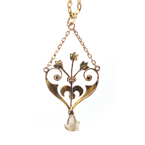 719 - Art Nouveau 9ct gold seed pearl pendant on a 9ct gold necklace, the pendant 4.7cm in length, approxi... 