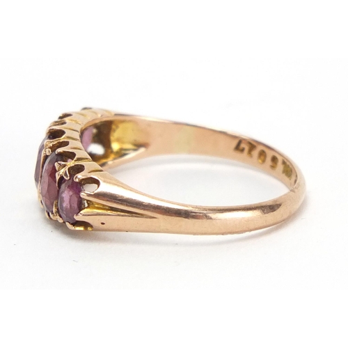 776 - 9ct gold garnet five stone ring, size O, approximate weight 2.3g