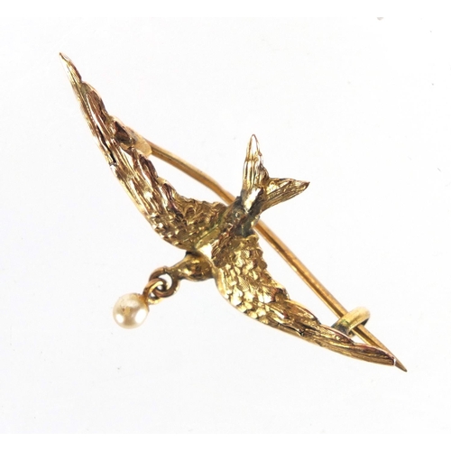 782 - 9ct gold swallow bar brooch set with a seed pearl, 4cm in length, approximate weight 1.4g