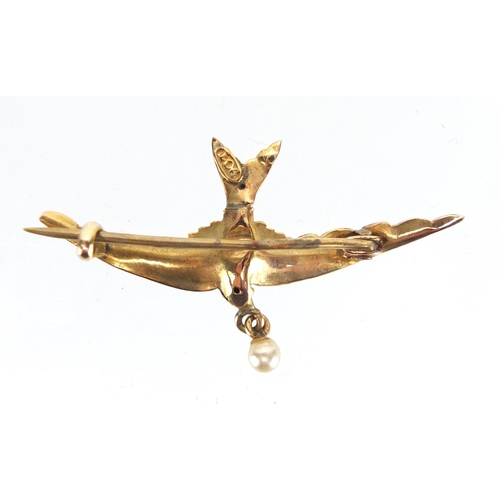 782 - 9ct gold swallow bar brooch set with a seed pearl, 4cm in length, approximate weight 1.4g