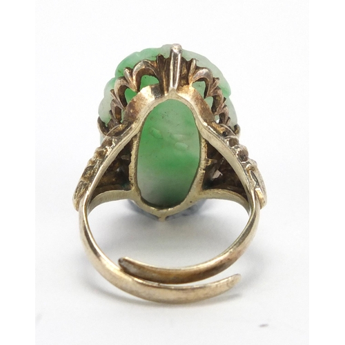 403 - Chinese silver and green jade ring carved with fruit amongst leaves, size O, approximate weight 7.6g