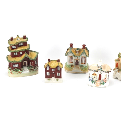 119 - Seven Staffordshire buildings including pastille burners and desk stand, the largest 16.5cm high