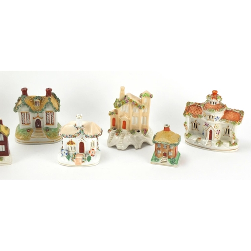 119 - Seven Staffordshire buildings including pastille burners and desk stand, the largest 16.5cm high