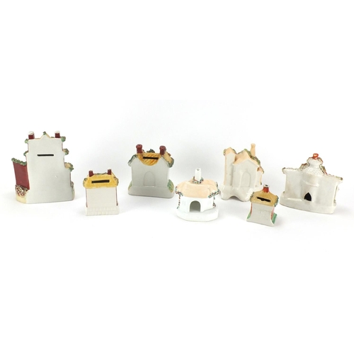 119 - Seven Staffordshire buildings including pastille burners and desk stand, the largest 16.5cm high