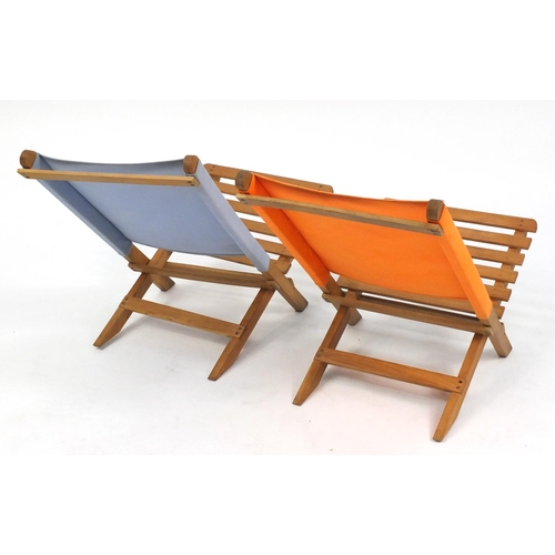 84 - Pair of folding wooden child's deckchairs