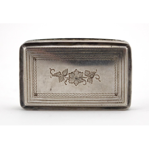 614 - Georgian silver snuff box, the hinged lid with floral chased decoration and gilt interior, Birmingha... 