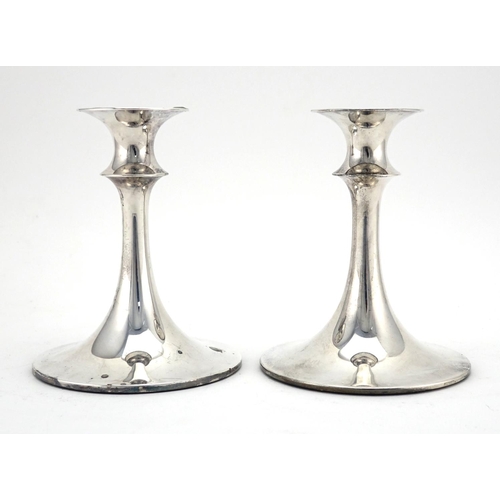 592 - Pair of Norwegian silver circular based candlesticks of tapering form by David Andersen, 15cm high, ... 