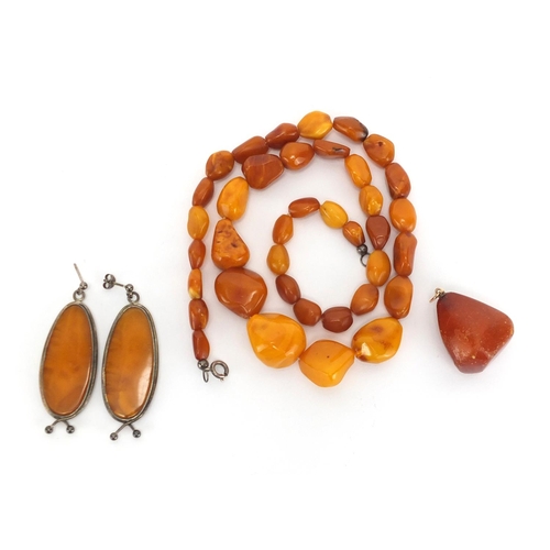 804 - Butterscotch amber coloured bead necklace, silver mounted earrings and pendant, approximate weight 4... 