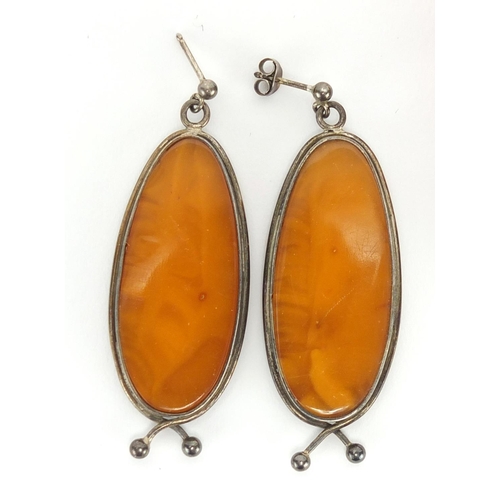 804 - Butterscotch amber coloured bead necklace, silver mounted earrings and pendant, approximate weight 4... 