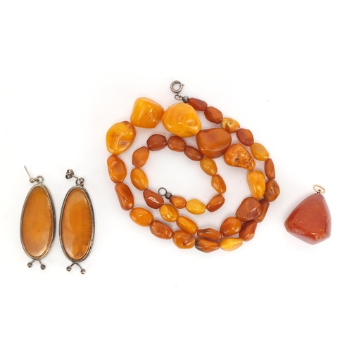 804 - Butterscotch amber coloured bead necklace, silver mounted earrings and pendant, approximate weight 4... 