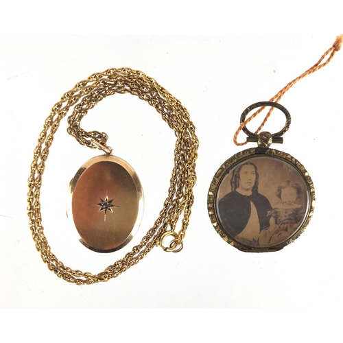 799 - 15ct gold back and front locket, set with a central diamond and a gilt metal mourning locket