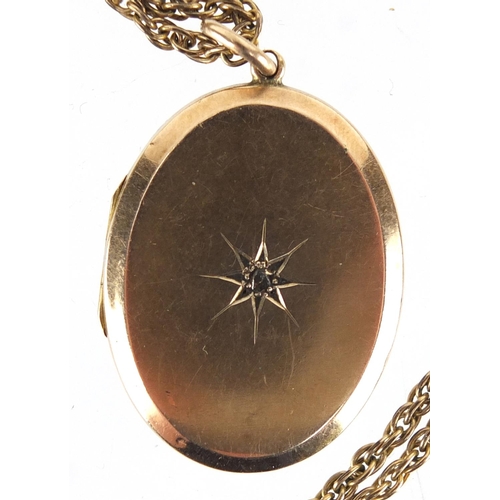 799 - 15ct gold back and front locket, set with a central diamond and a gilt metal mourning locket