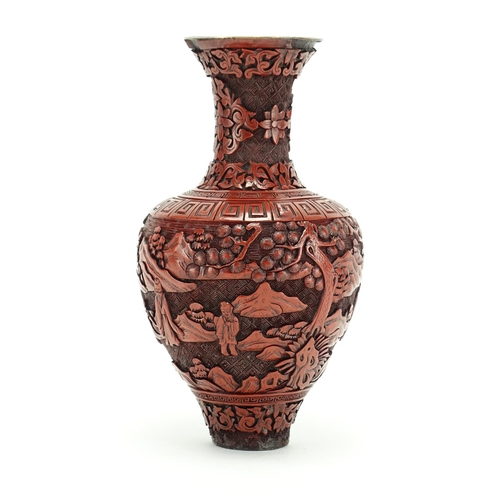 382 - Chinese cinnabar lacquer vase carved with figures in a landscape, 21.5cm high