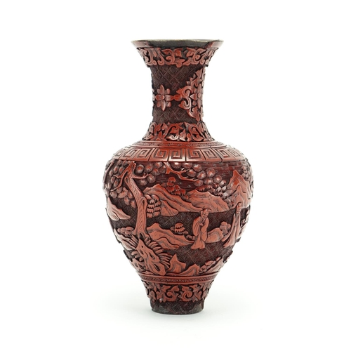 382 - Chinese cinnabar lacquer vase carved with figures in a landscape, 21.5cm high