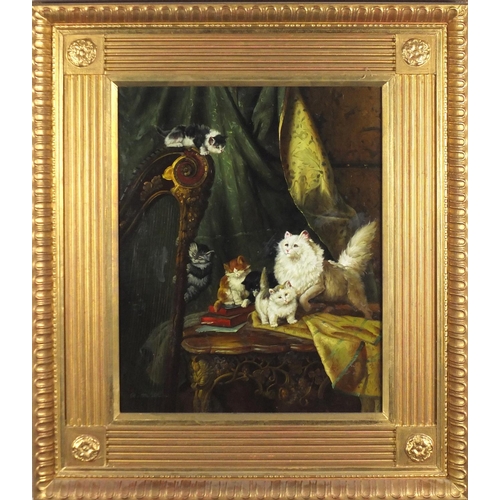 2064 - G Metsu - Cats and kittens by a harp, oil on panel, mounted and framed, 49.5cm x 39cm