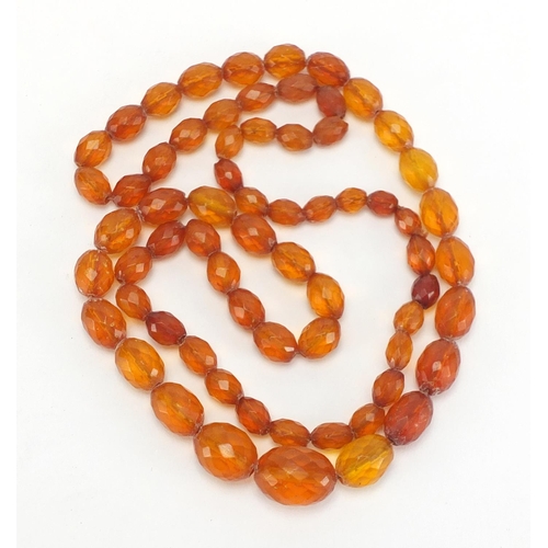 817 - Amber coloured fasciated graduated bead necklace, 86cm in length,  approximate weight 50.6g