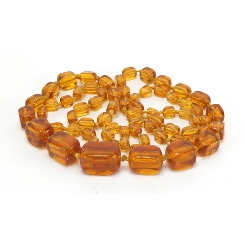 818 - Amber coloured graduated bead necklace, 80cm in length, approximate weight 67.0g