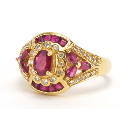 714 - 18ct gold ruby and diamond dress ring, housed in a Charles Fox Bournemouth tooled leather box, size ... 