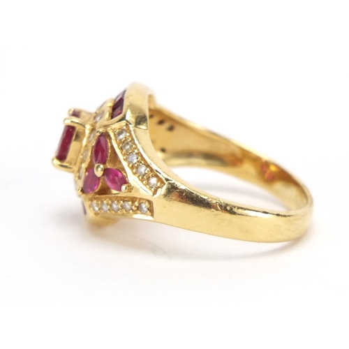 714 - 18ct gold ruby and diamond dress ring, housed in a Charles Fox Bournemouth tooled leather box, size ... 