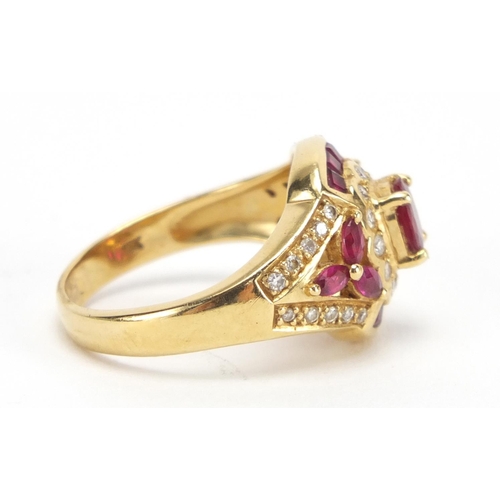 714 - 18ct gold ruby and diamond dress ring, housed in a Charles Fox Bournemouth tooled leather box, size ... 