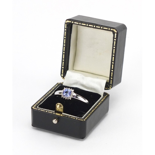 693 - 18ct white gold tanzanite and diamond ring, housed in a tooled leather box, size U, approximate weig... 