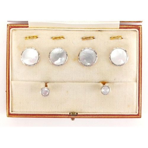 683 - Set of 18ct gold, platinum and Mother of Pearl buttons and studs, housed in a Goldsmith's & Silversm... 