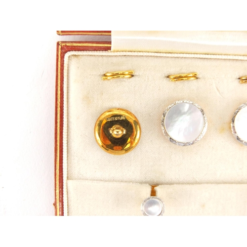 683 - Set of 18ct gold, platinum and Mother of Pearl buttons and studs, housed in a Goldsmith's & Silversm... 