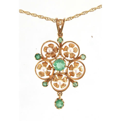 688 - 9ct gold emerald seed pearl pendant on a 9ct gold necklace, the pendant 3.7cm in length, approximate... 