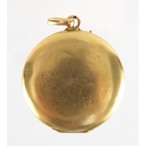 758 - Victorian unmarked gold ruby and seed pearl locket, 3cm in diameter, approximate weight 6.1g